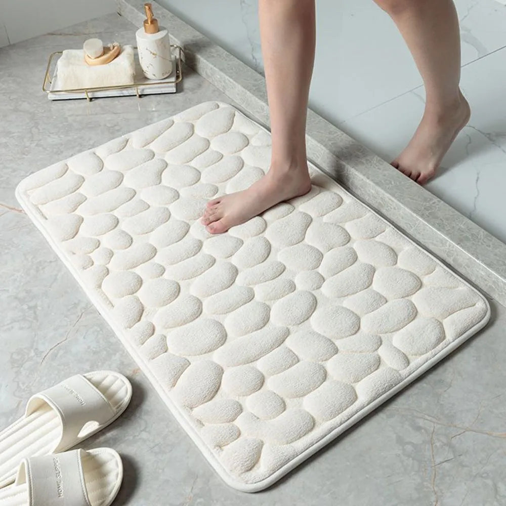 Tapis de bain antidérapant en relief avec pavés et absorbant l'eau blanc