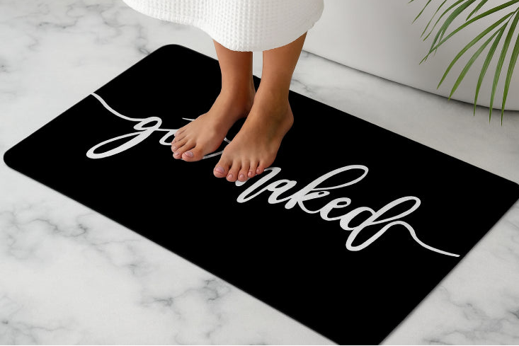 Tapis de bain get naked pieds noir