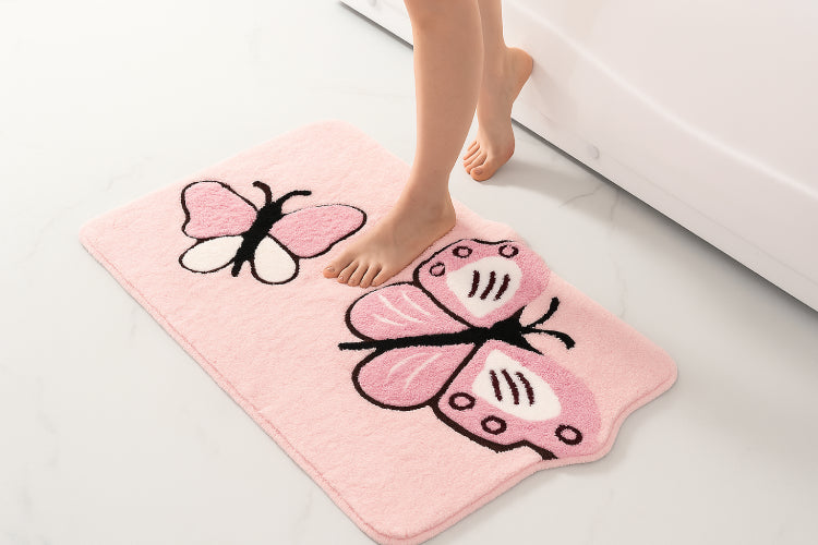 Tapis de bain papillon rose clair 